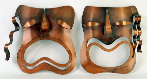 Appraisal: Pair of mid-century cut sheet copper wall-hangings of Comedy and