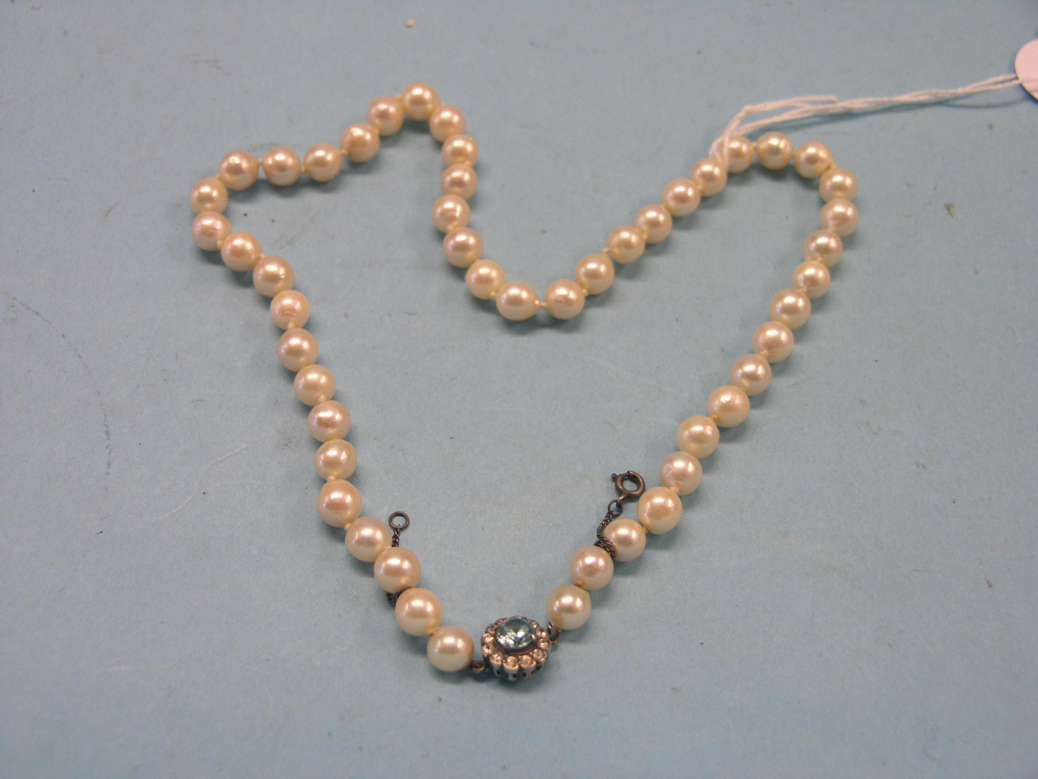 Appraisal: A pearl necklace ct gold rosette clasp set aquamarine and