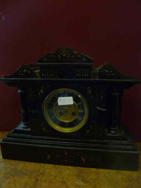 Appraisal: A VICTORIAN BLACK SLATE MANTEL CLOCK with inset marble panels