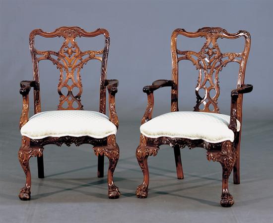 Appraisal: Pair Irish Chippendale style carved mahogany armchairs shaped and molded