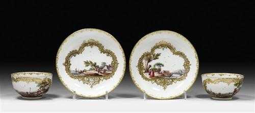 Appraisal: PAIR OF CUPS AND SAUCERS WITH LANDSCAPE SCENES Meissen circa