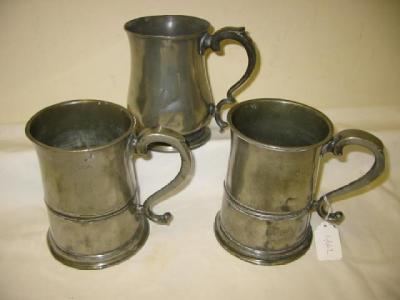 Appraisal: A PAIR OF VICTORIAN PEWTER TANKARDS of quart measure the