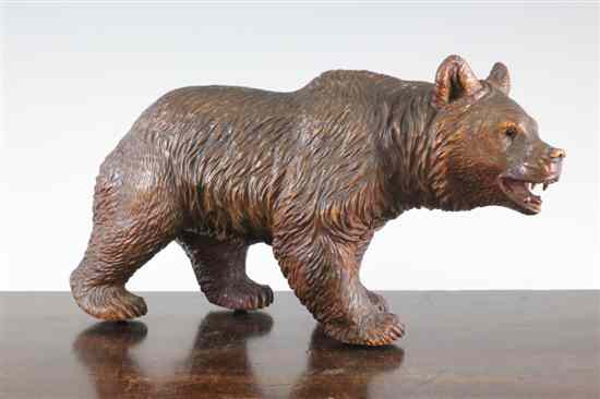 Appraisal: A th century Black Forest carved wood model of bear