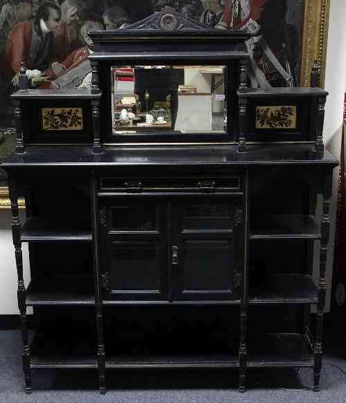 Appraisal: An Aesthetic Movement ebonised side cabinet circa the superstructure with