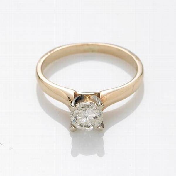 Appraisal: A diamond and k gold solitaire ring