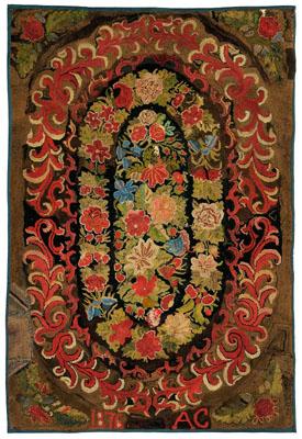 Appraisal: floral hooked rug central floral medallion within a scrolled border