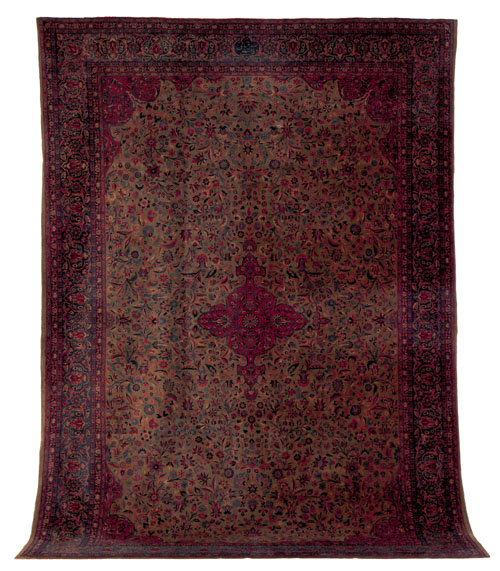 Appraisal: Kashan carpet ca with a red medallion on an olive