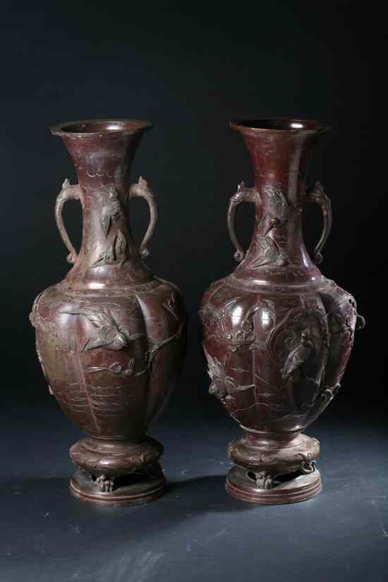 Appraisal: PAIR JAPANESE BRONZE VASES Cast with bird and floral decoration