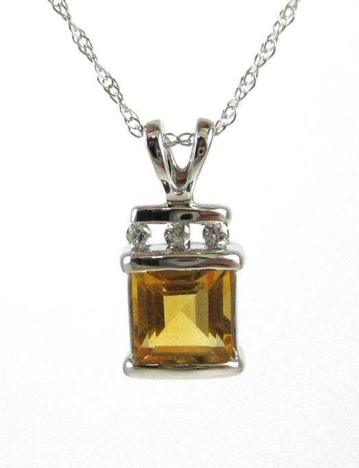 Appraisal: CITRINE AND FOURTEEN KARAT GOLD PENDANT NECKLACE with an inch