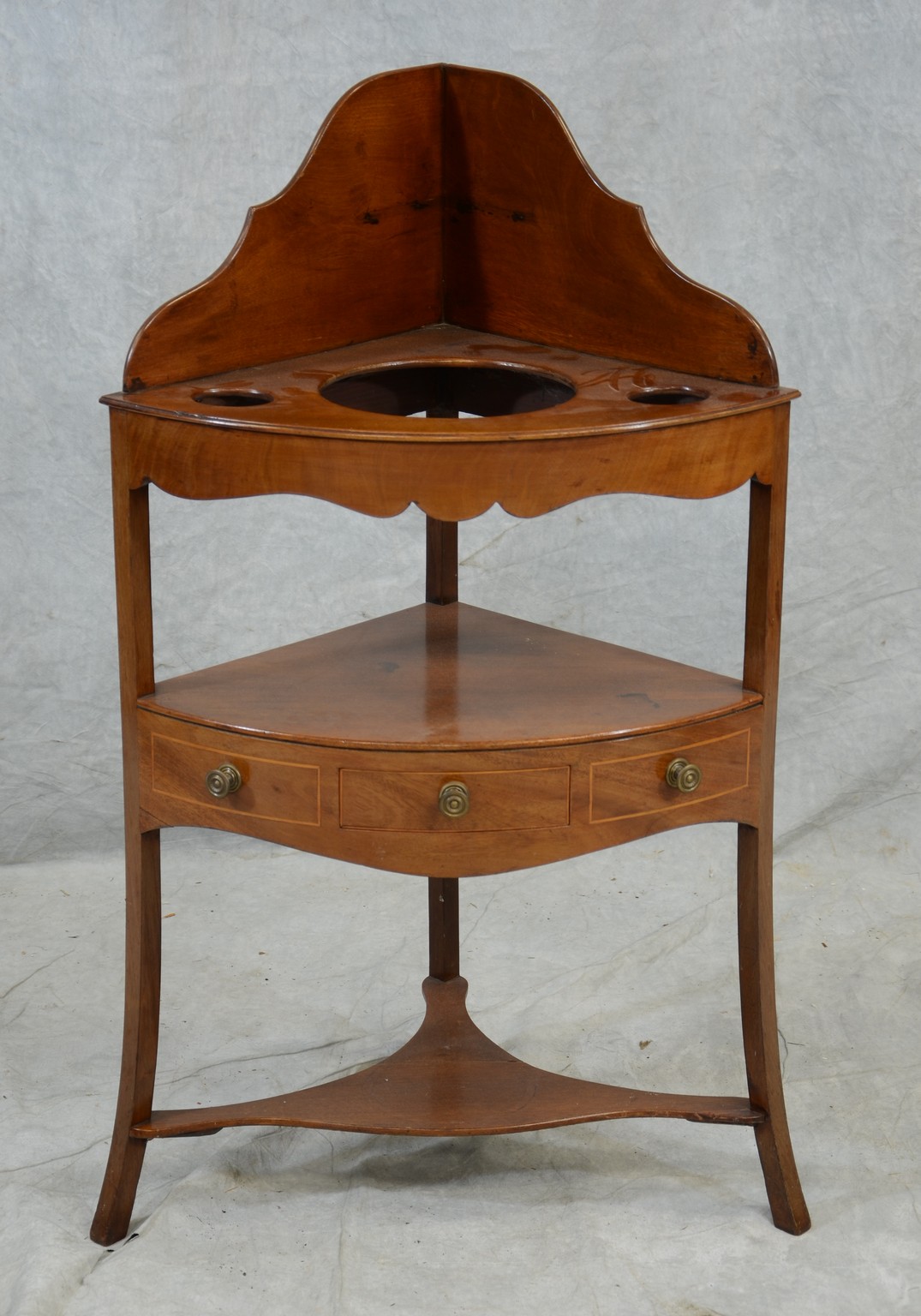 Appraisal: Mahogany George III corner wash stand with high dovetailed and