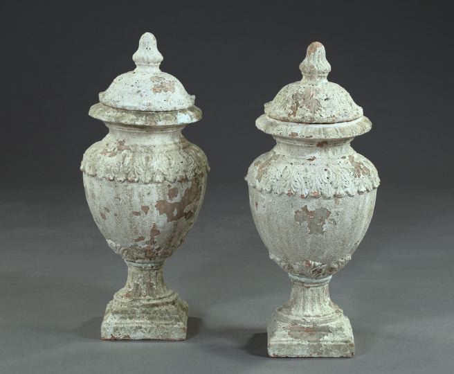 Appraisal: A Pair of Lidded Terra Cotta and Distressed Painted Urns