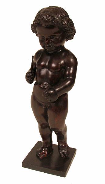 Appraisal: A carved wood figure of a putto on a later