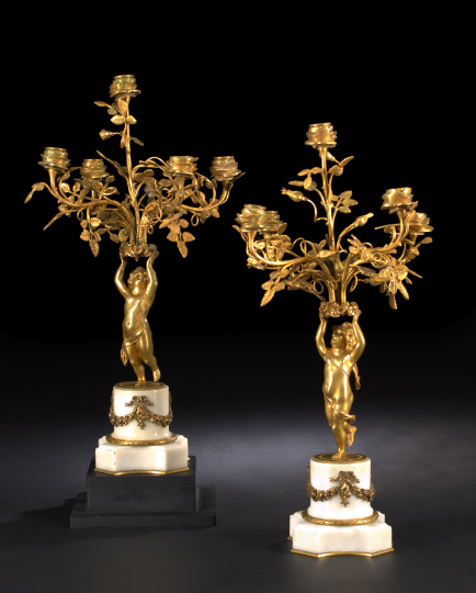 Appraisal: Pair of French Gilt-Bronze and White Carrere Marble Five-Light Putto