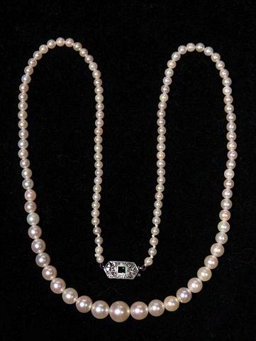 Appraisal: A GRADUATED CULTURED PEARL NECKLACE with an emerald and diamond