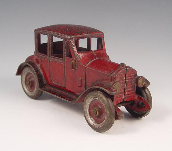 Appraisal: CAST IRON KENTON TOY COUPE Original red paint Nickeled wheels