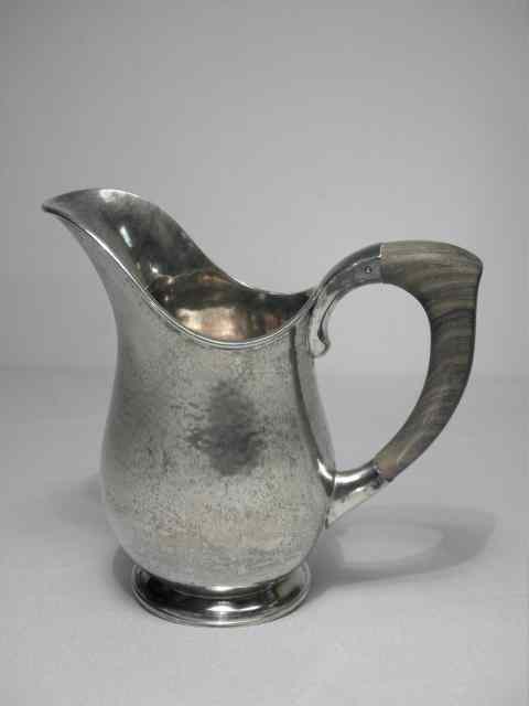 Appraisal: Scandinavian hammered silver water pitcher made by J Dix Bonn