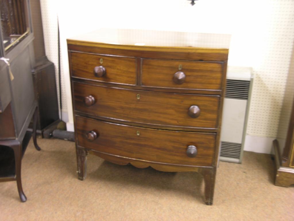 Appraisal: An early th century mahogany bow fronted chest inlaid frieze