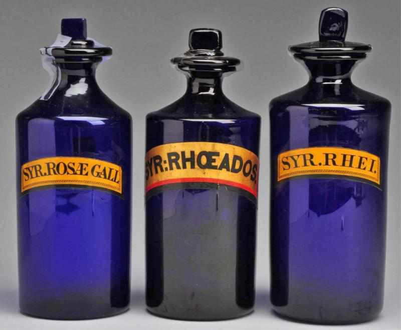 Appraisal: Lot of Round Cobalt Glass Syrup Bottles Description Circa to