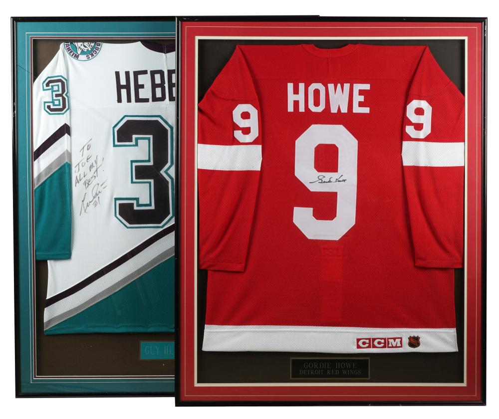 Appraisal: TWO SIGNED FRAMED HOCKEY JERSEYScomprising one Guy Hebert x inches