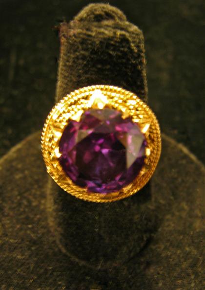 Appraisal: Yellow gold and synthetic alexandrite ringRound cut alexandrite set in