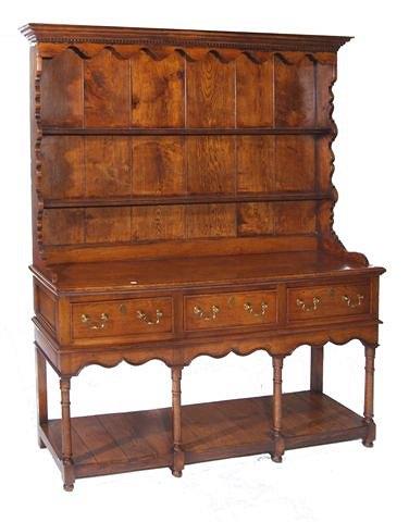 Appraisal: A Georgian style oak dresser with plate rack above and