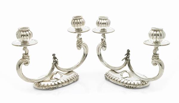 Appraisal: A pair of Italian standard silver console candelabra Each with