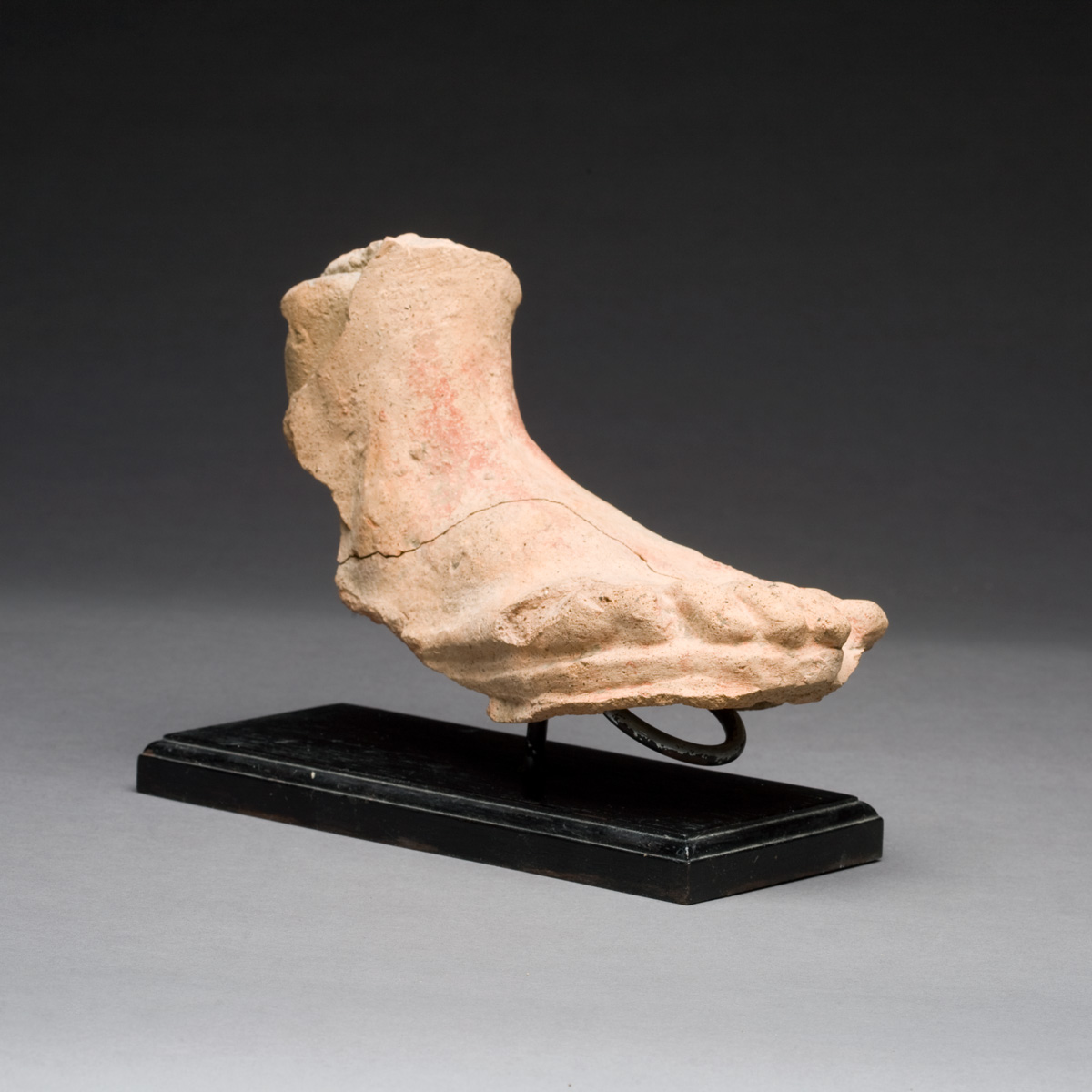 Appraisal: ETRUSCAN TERRACOTTA VOTIVE FOOT Mounted on a metal stand Length