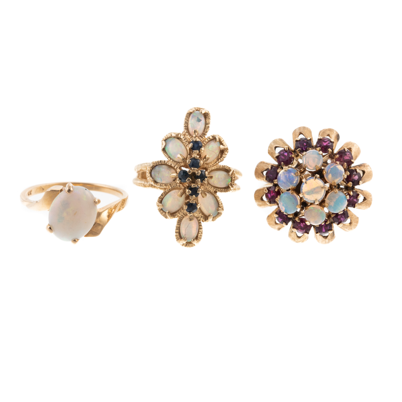 Appraisal: A TRIO OF OPAL RINGS IN K K YELLOW GOLD