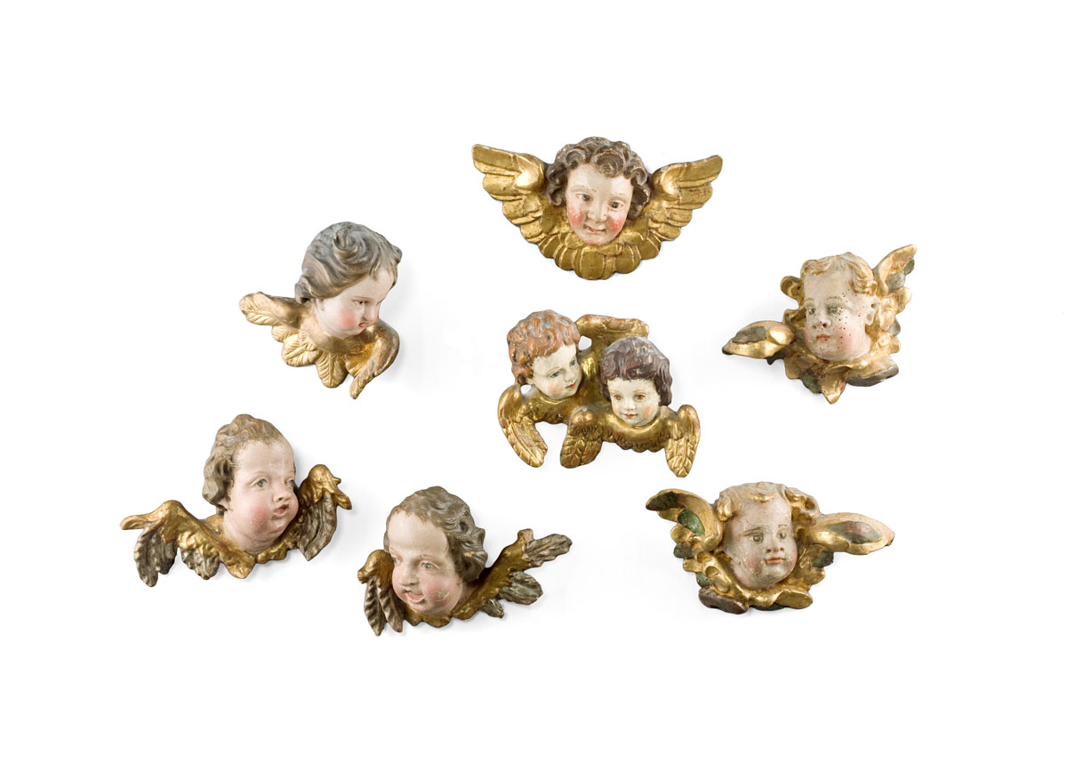 Appraisal: SEVEN CONTINENTAL PAINTED AND GILT CHERUBIM Including a double portrait