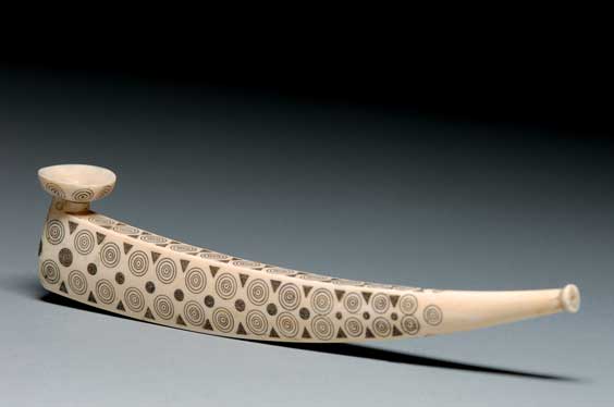 Appraisal: ESKIMO CARVED IVORY PIPE Eskimo carved ivory pipe of curvilinear