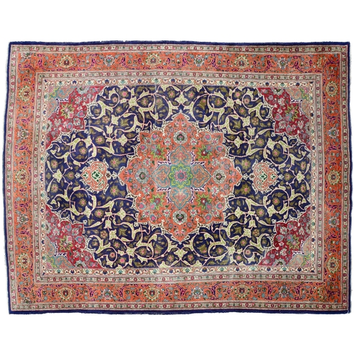 Appraisal: An indigo ground medallion carpet x cm More Information Localised