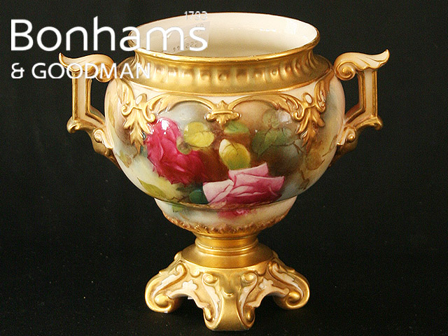 Appraisal: A Hadley Royal Worcester twin handled pedestal vase painted with