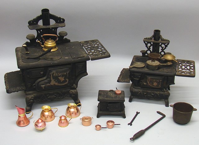 Appraisal: Group of cast iron stoves H Dot stove and bank