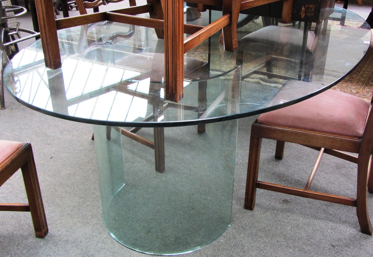 Appraisal: A th century plate glass dining table the oval top