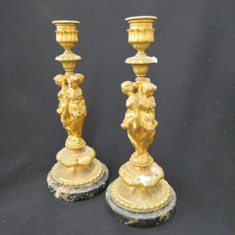 Appraisal: Pair of French Bronze Figural Candlesticks a trio of maidens