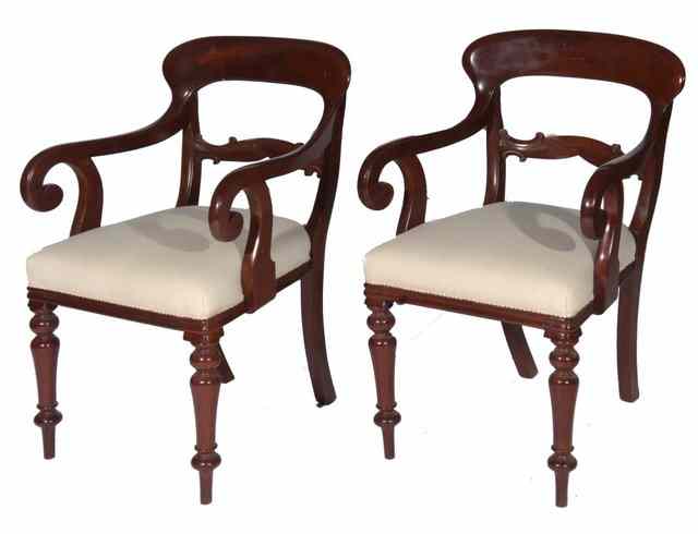 Appraisal: A PAIR OF VICTORIAN MAHOGANY CARVER CHAIRS with spade backs