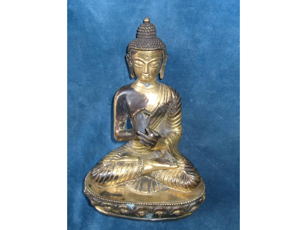 Appraisal: A Tibetan bronze figure of a seated Buddha