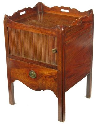 Appraisal: A late George III mahogany bedside commode the shaped tray