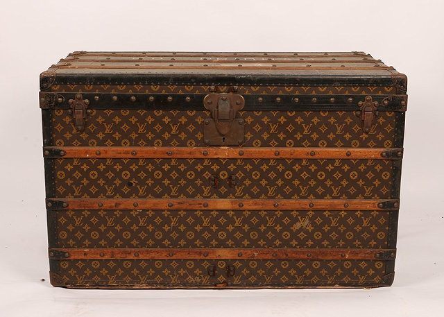 Appraisal: A LOUIS VUITTON RECTANGULAR CABIN TRUNK with stylistic monogram decoration