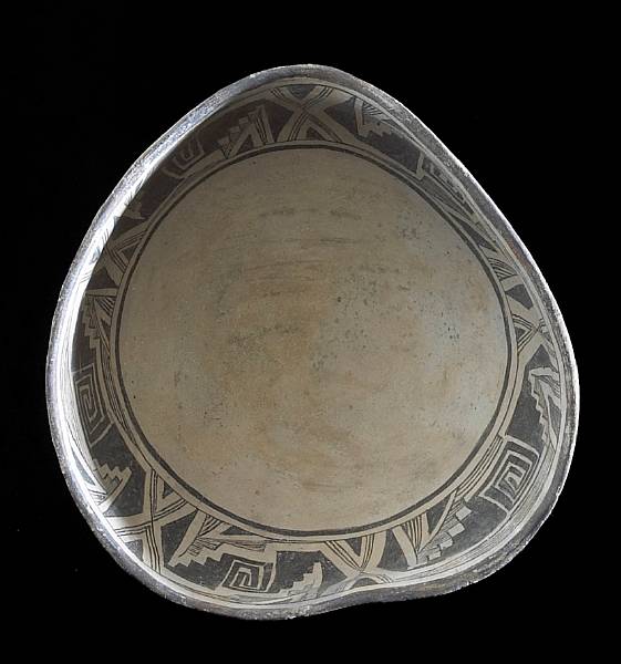 Appraisal: A Mimbres black-on-white bowl Decorated with a repeating rim band