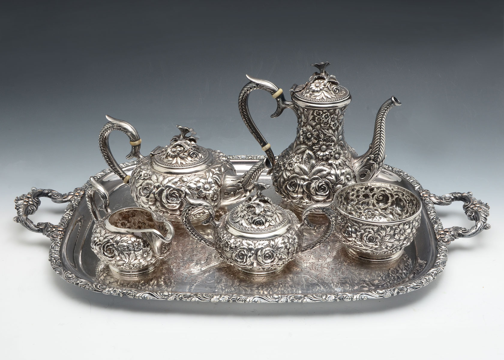 Appraisal: KIRK STIEFF REPOUSSE HAND CHASED STERLING TEA SET Approx Troy