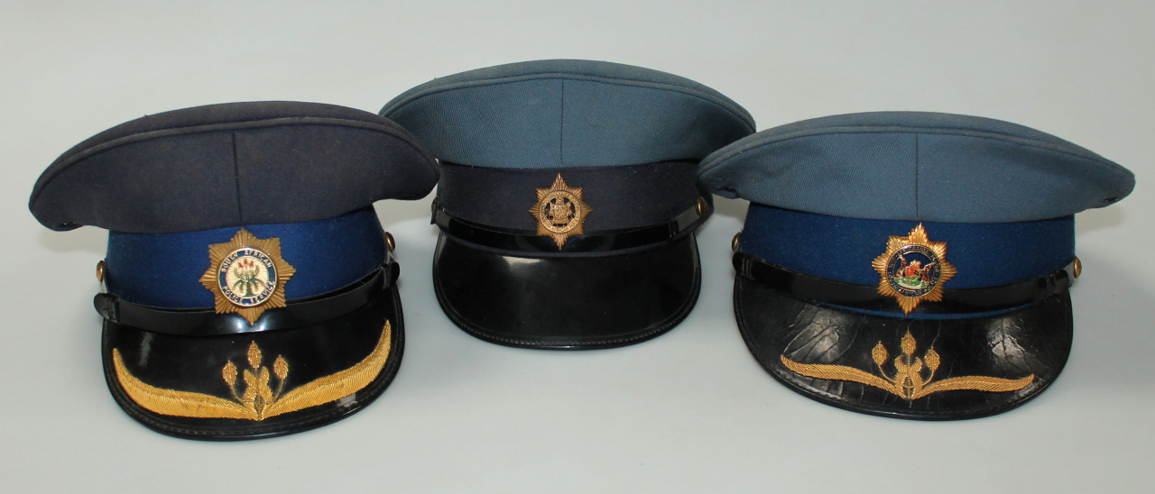 Appraisal: A thC blue velvet peaked cap with South African police