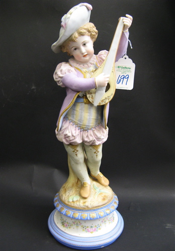 Appraisal: GERMAN PAINTED BISQUE PORCELAIN FIGURE of a boy playing a