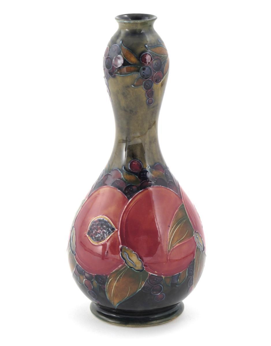 Appraisal: Pomegranate a Moorcroft Pottery bottle vase designed by William