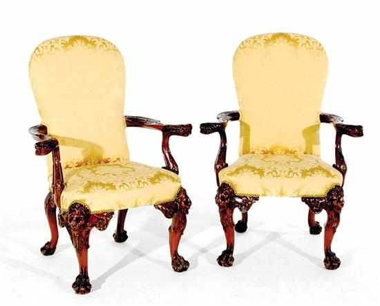 Appraisal: Pair George III style carved mahogany armchairs shaped upholstered back