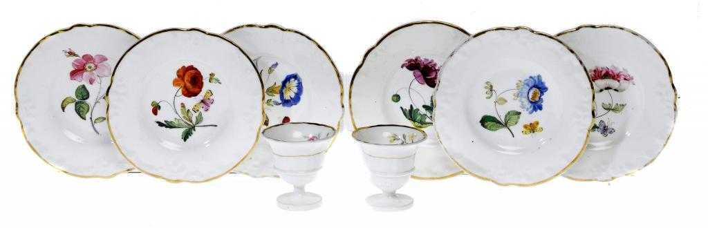 Appraisal: A SET OF SIX ROCKINGHAM MOULDED BOTANICAL CUP-PLATES AND A