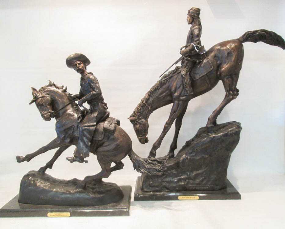 Appraisal: TWO PATINATED BRONZE SCULPTURES AFTER FREDERIC REMINGTON depicting figures on