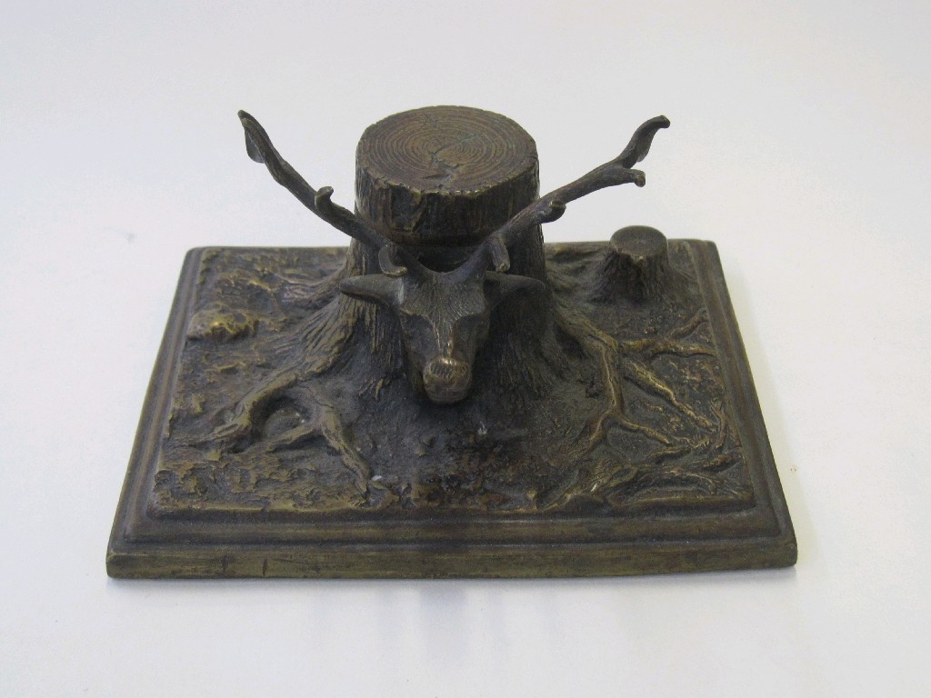 Appraisal: Cast bronze inkwell modelled as a tree trunk with a