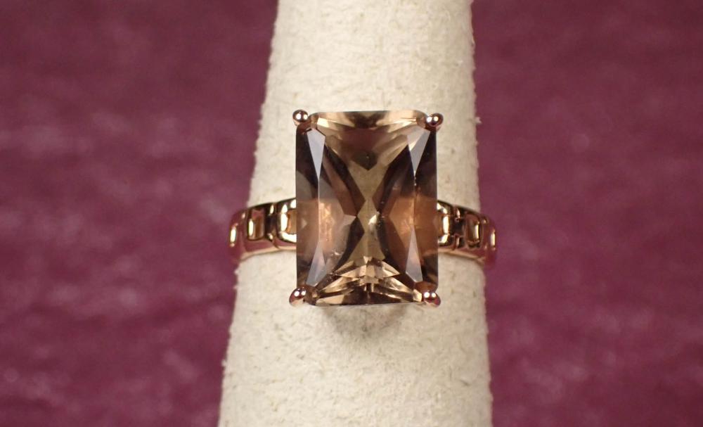 Appraisal: SMOKY QUARTZ AND FOURTEEN KARAT ROSE GOLD RING with four