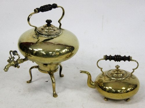 Appraisal: A large brass urn on tripod base with tap cm